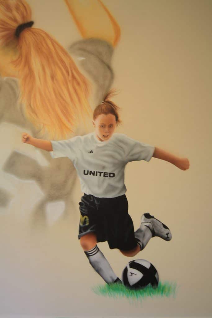 painted wall mural - girl playing soccer