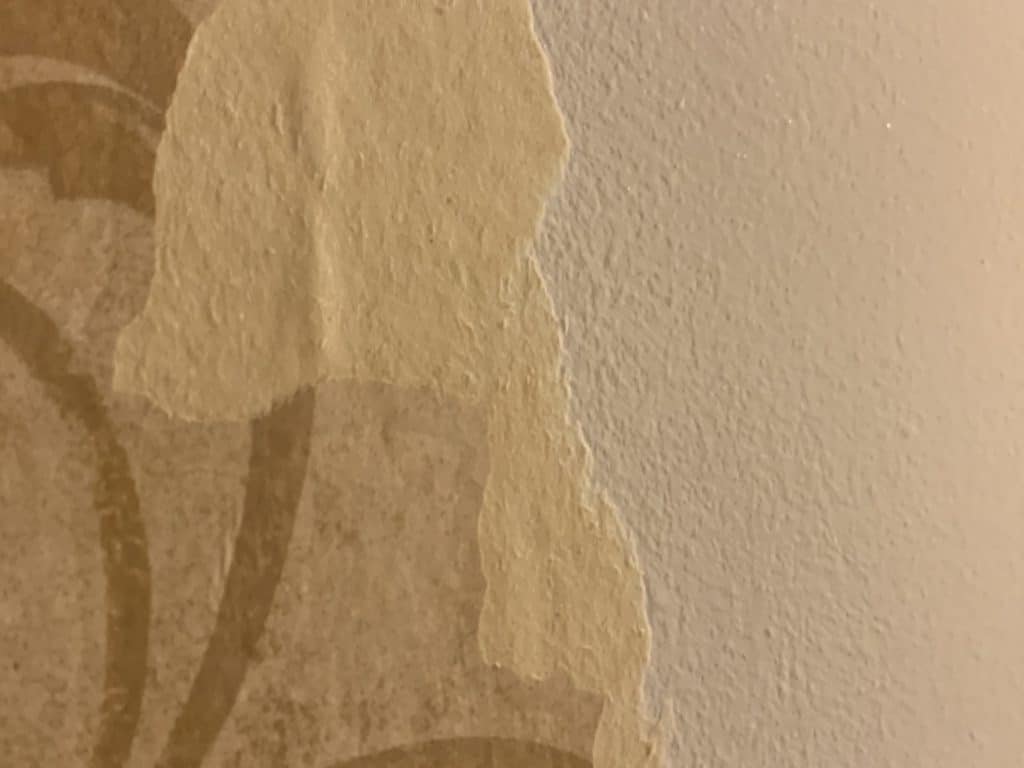 peel wallpaper off after it starts to bubble